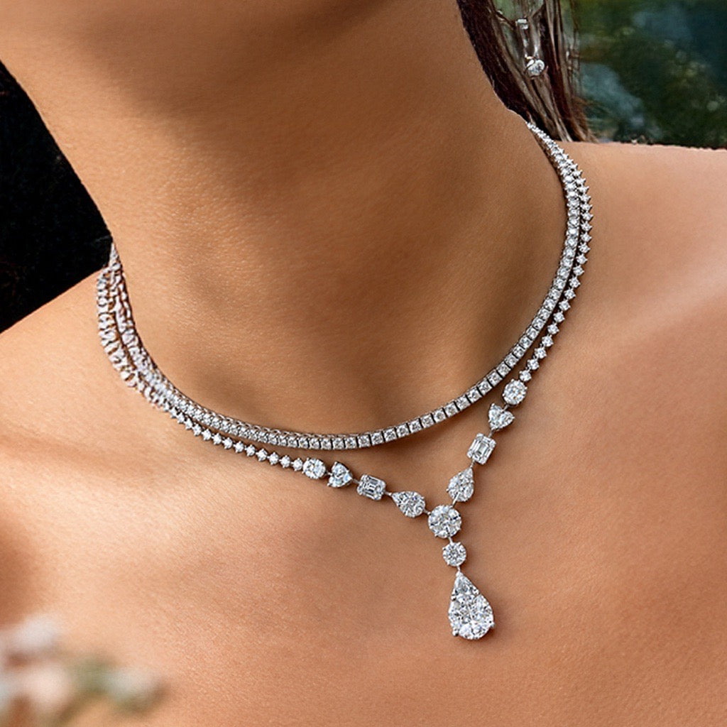 Layered diamond necklace with a pear-shaped diamond pendant drop